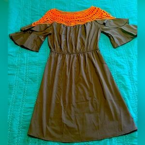 Grey with orange detail.. Super cute and light material!! Open shoulder